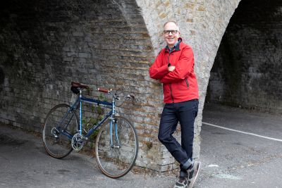 David Bonney standing with a bike